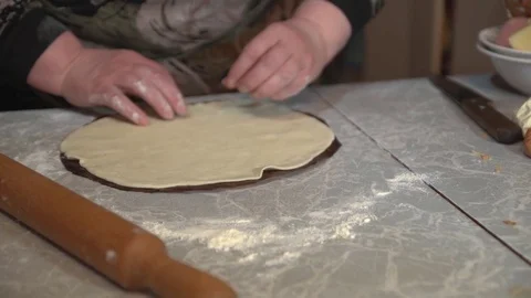 Preparation of the test for homemade pizza on a light kitchen table. Stock Footage 74994226