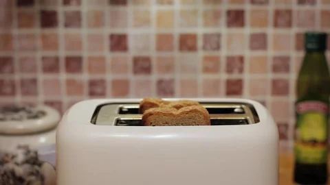 Preparation of toast. Toaster. Bread cooked in a toaster. Stock Footage 82866237