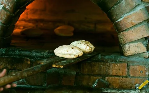 . Preparation of tradition arabic bread Stock Photos