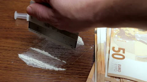The preparation of two strips of drug on the background of money and syringes Stock Footage 152923064