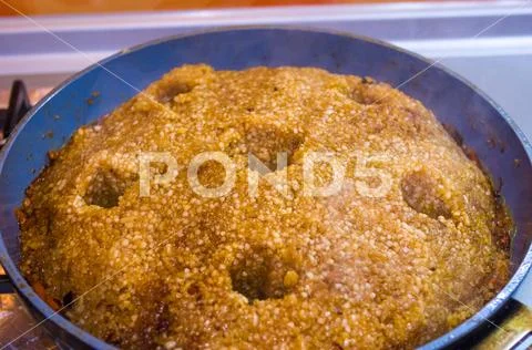 Preparation of Uzbek pilaf - evaporation of water from rice, close up Stock Photos