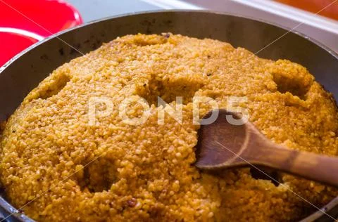 Preparation of Uzbek pilaf - evaporation of water from rice, close up Stock Photos