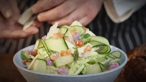 Preparation of vegetarian salad. Adding cheese to salads Slow motion 50fps. Stock Footage 305387690