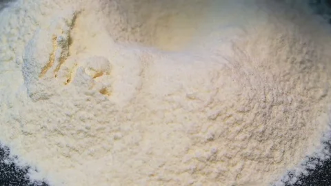 Preparation of wheat flour for baking. Texture close-up. Smooth rotation Video stock 84002086