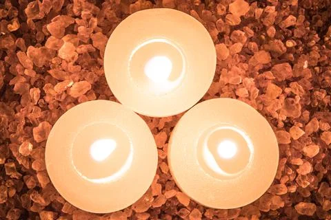 Preparations for the bath and aromatherapy : three decorative candle stand in Stock Photos