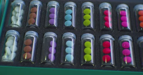 Preparations of different colors, packaged in identical transparent bottles 스톡 동영상 236351635