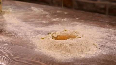 Preparations for making dough. Fresh eggs with flour and oil Stock Footage 148796714