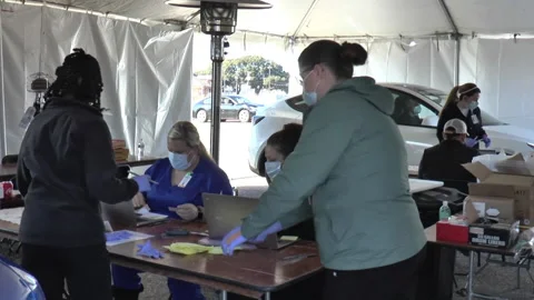 Preparations of Pfizer vaccines for elderly at drive through point in Louisiana Stock Footage 148088256