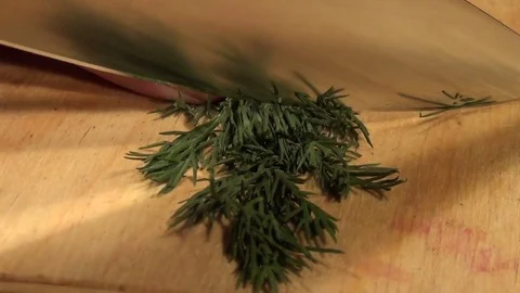 Prepare and chop the lush greenery for cooking Stock Footage 70642341