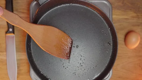 Prepare and Cook Delicious Egg Dishes Using a Wooden Spoon in a Pan during Food Stock Footage 306014223