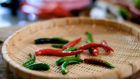 Prepare and dropping the chili pepper in to basket Stock Footage 100729536