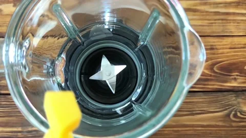 Prepare to cooking mango smoothie, puts mango in blender Video stock 89488141