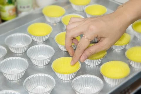 Prepare cupcake liners in tray before baking Stock Photos