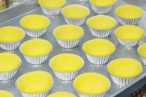 Prepare cupcake liners in tray before baking Stock Photos
