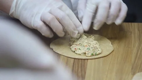 Prepare the dough for baking pies stuffed with meat Stock Footage 69994140