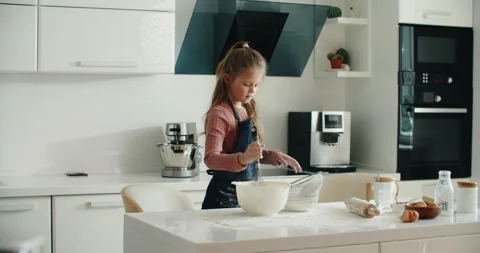 Prepare dough for bread, pizza, pasta and dessert. A cheerful girl of European Stock Footage 201299078
