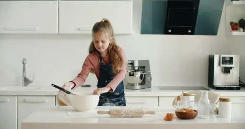 Prepare dough for bread, pizza, pasta and dessert. A cheerful girl of European Stock Footage 201299169