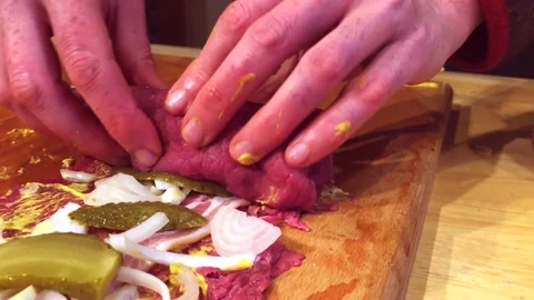 Prepare a fresh beef roulade on a cutting board. Video stock 140598858