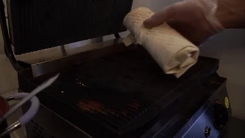 Prepare shawarma, meat on a spit, cut the shred vegetables for shawarma Video stock 83966809
