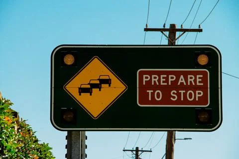 Prepare To Stop Traffic Sign With Flashing Lights Along A Busy Road Under A.. Stock Photos