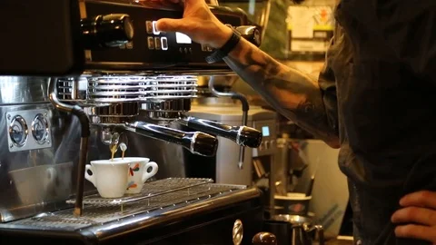 Prepare two espresso coffees with the bar machine in Italy Stock Footage 120030724