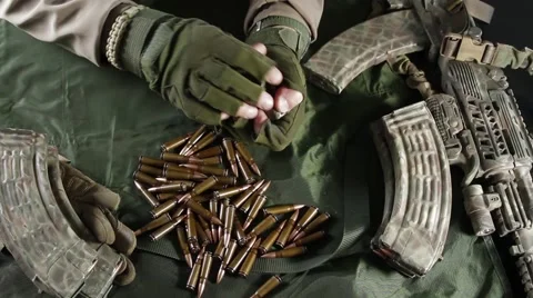 Prepare weapons for battle. Equipment bullets. Close-up Video stock 62909588