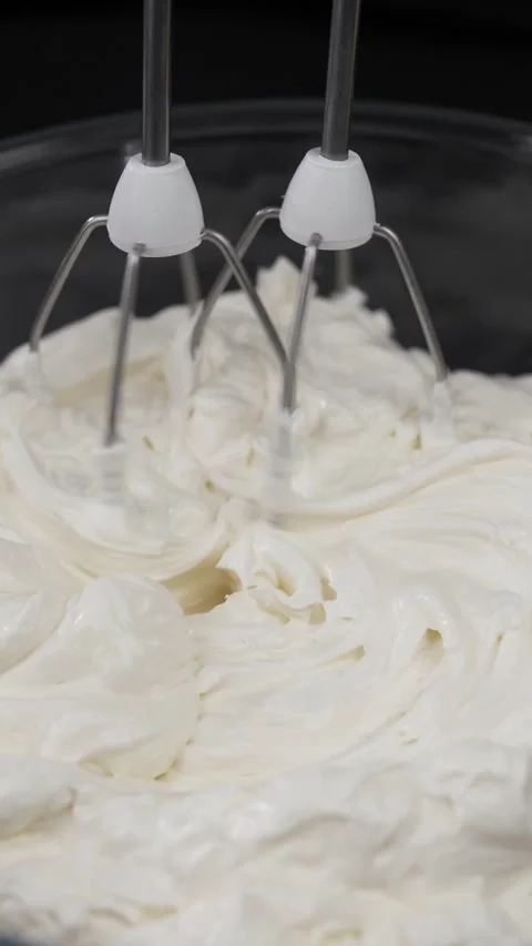 Prepare whipped cream using a mixer. Stock Footage 281667609