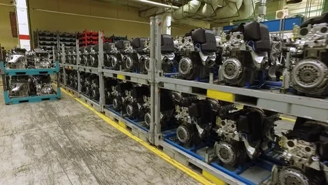 Prepared car engines are standing in shelfs in workshop of modern automobile Stock-Footage 79192529