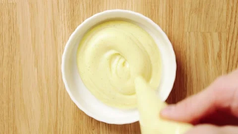 Prepared custard is piped from pastry bag into ramekin. Stock Footage 345273418