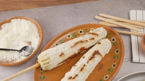 Prepared elotes accompanied with all the ingredients used in its preparation Stock Footage 280316801