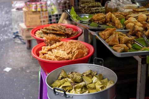 Prepared foods and fried snacks at Bangkok market Stock Photos