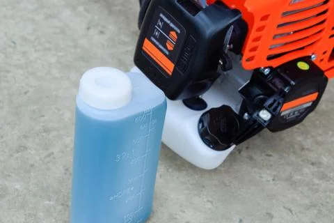 Prepared fuel mixture for a two-stroke gasoline trimmer engine. Gasoline trim Stock Photos
