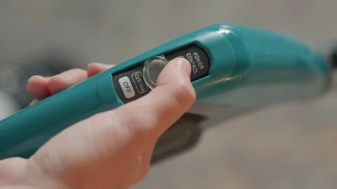 Prepared household steamer with illuminated controls demonstration. Showcasing Stock Footage 336863912