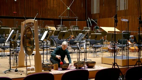 Prepared for the orchestra stage. there are chairs, music stands and microphones Stock Footage 128770838