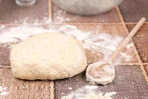 Prepared pizza dough on the table Stock Photos