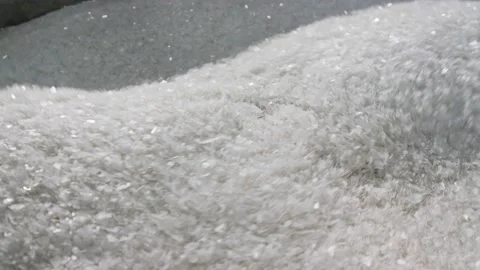 Prepared Plastic Raw Materials For Reuse Are Mixed In a production bowl Stock Footage 219558571