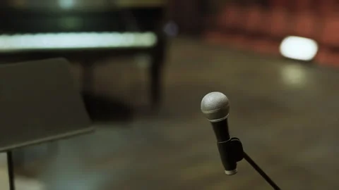 Prepared stage awaiting. Unoccupied stage with microphone ready for performance Stock Footage 329944201