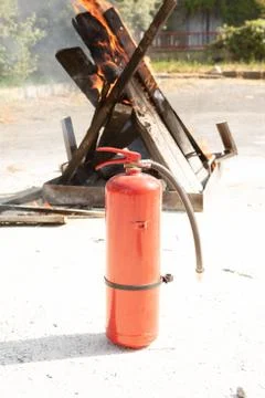 Preparedness for fire drill and training to use a powder type fire extinguish Stock Photos