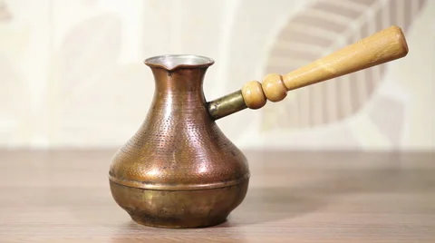 Prepares coffee in the pot Stock Footage 60764377