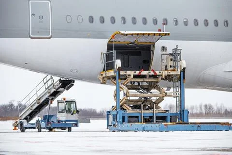 Preparing the aircraft before flight. Loading of baggage. Loading of cargo. L Stock Photos