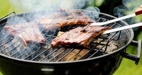 Preparing american bbq ribs on grill Stock Footage 90950940