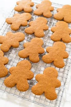 Preparing and Baking Classic Gingerbread Cookies in Gingerbread Man Shapes Stock Photos