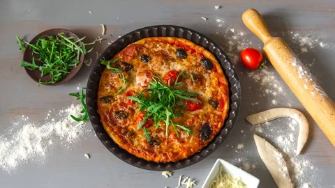Preparing and baking tasty pizza Stock Footage 129512347