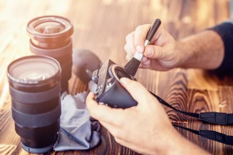 Preparing and cleaning set of photography equipments for shoting pictures Stock Photos