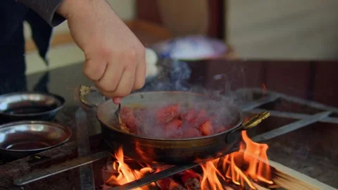 Preparing and cooking chicken in a traditional outdoor oven. Stock Footage 310016982
