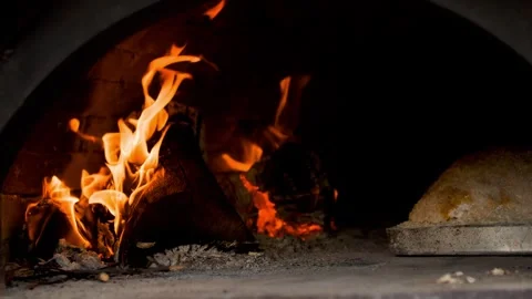 Preparing and cooking chicken in a traditional outdoor oven. Stock Footage 310017684