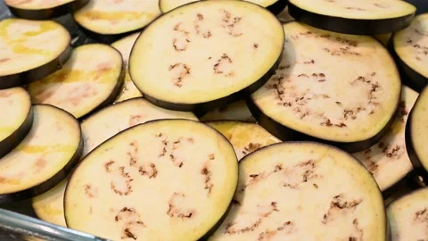 Preparing and lining sliced aubergines with oil Stock Footage 219878438