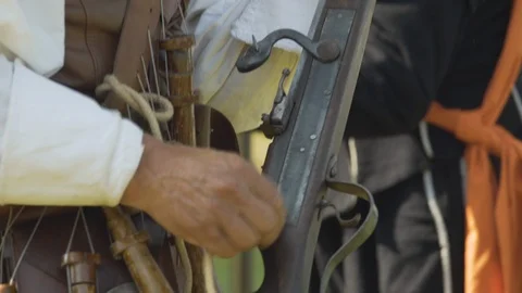 Preparing and loading an old Gun Musket. Reenactment. Close up. Stock Footage 104782124
