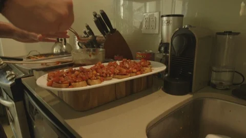 Preparing and Making Bruschetta With Tomato and Vinegar Stock-Footage 121288214