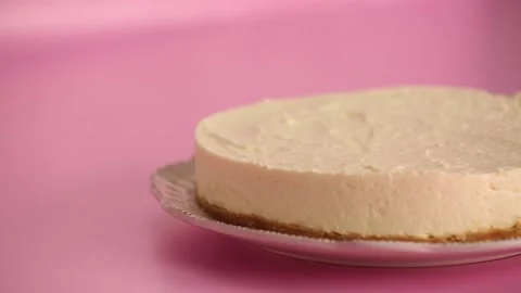 Preparing and serving a cheesecake with berry toppings Stock Footage 133807648